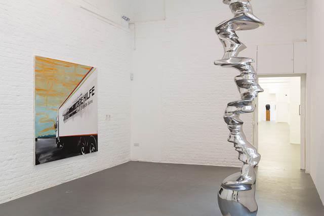 “A House of Leaves” installation view showing (left to right) Wilhelm Sasnal <em>Untitled (Humanitäre Hilfe)</em> 2011 and Tony Cragg <em>The Fanatics</em> 2006 / photo David Roberts Art Foundation