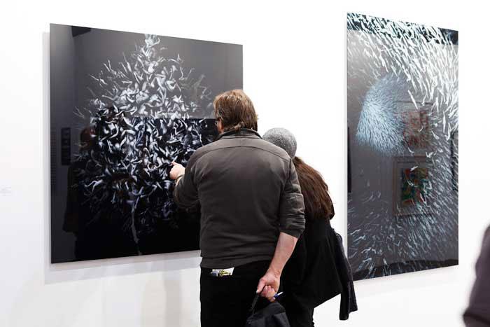 Visitors admiring <em>Progeny</em> by Angelo Musco at the Carrie Secrist Gallery booth during Art Toronto 2011 / photo courtesy of Art Toronto and Arash Moallemi