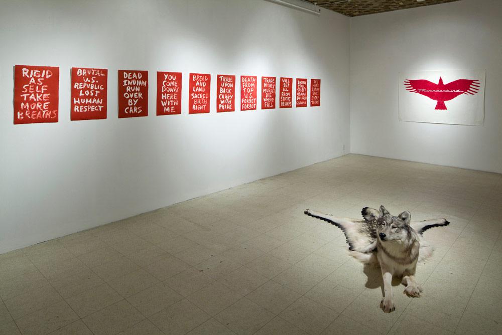 Nicholas Galanin's wolf sculpture <em>Inert</em> (at right) along with works by Edgar Heap of Birds and Tania Willard at Art Mûr's 