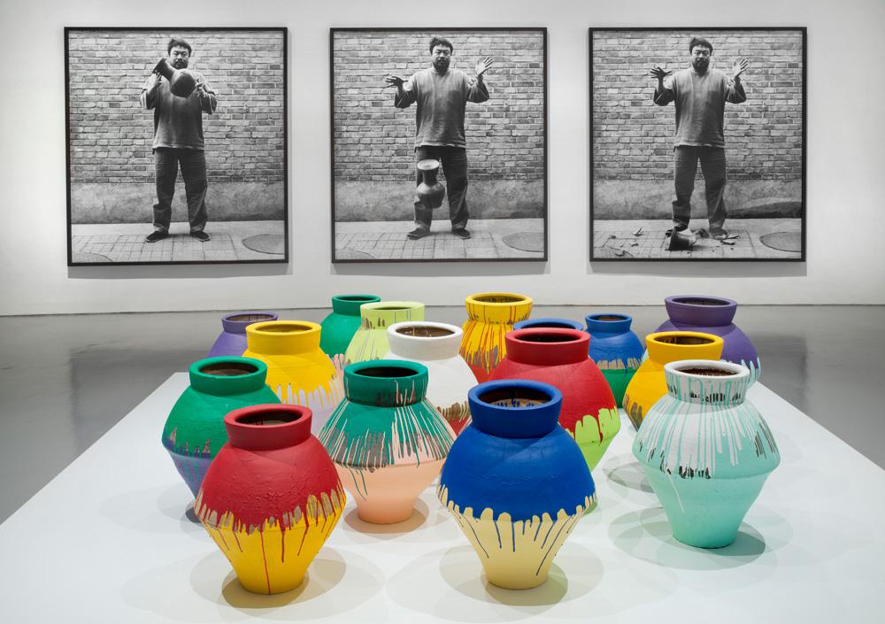 Ai Weiwei (background) <em>Dropping a Han Dynasty Urn</em> 1995/2009 (foreground) <em>Colored Vases</em> 2007–10 Installation view Courtesy Hirshhorn Museum, Washington / photo Cathy Carver