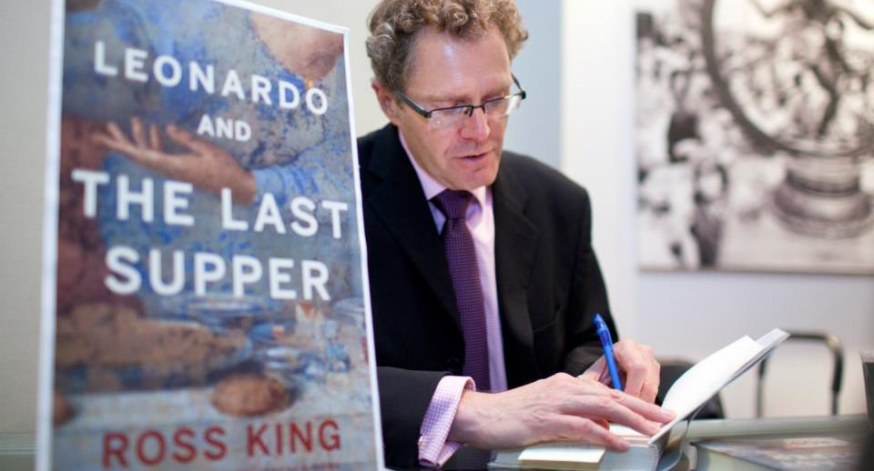 Ross King at signs books at a fall 2012 Canadian Art Foundation International Speaker Series event