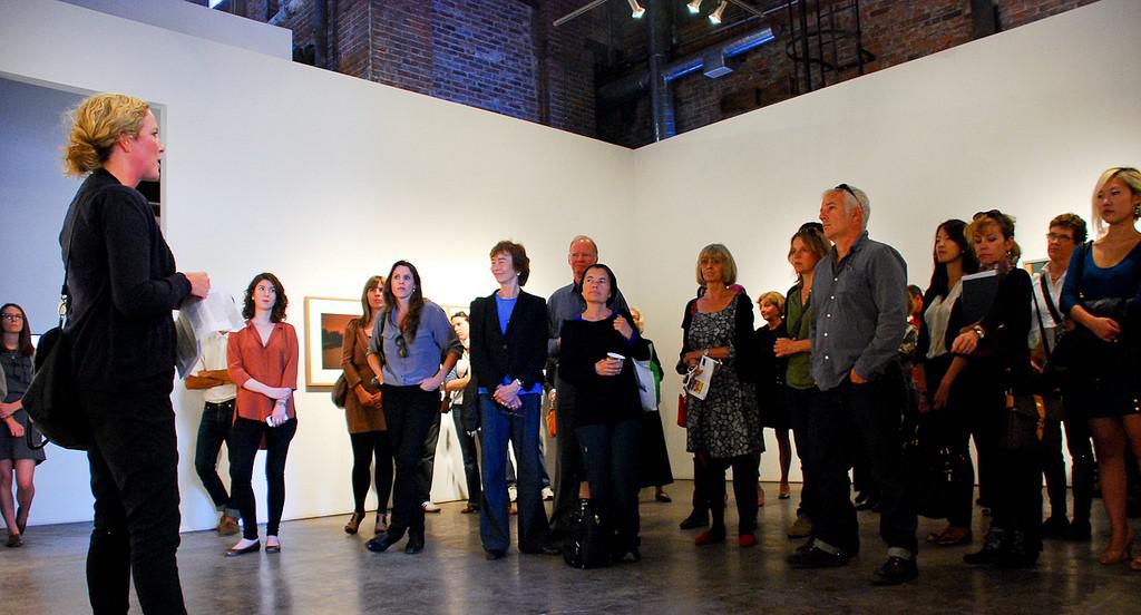 Curator Melanie O'Brian talks at Monte Clark Gallery Toronto during the 2011 Gallery Hop / photo Mariam Nader